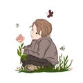 Boy sitting on grass